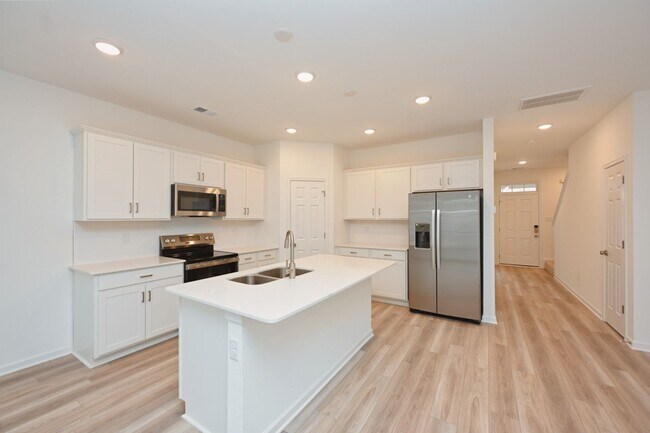 Building Photo - **BE THE FIRST PERSON TO LIVE IN THIS BRAND NEW BRICK TOWNHOME IN THE VILLAS AT REGAL SQUARE FEAT...