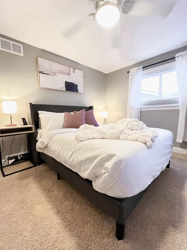 Bedroom 3 - Queen-sized mattress with two nightstands and bedside lamps with USB charging hubs. This - 1237 Giesse Dr