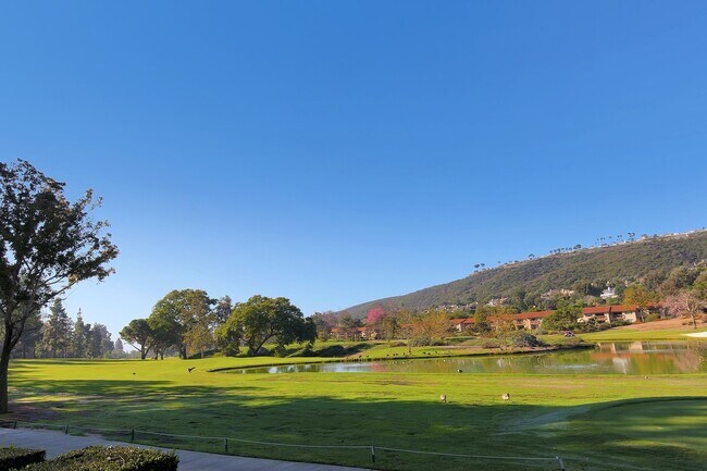 Building Photo - Lake and Golf Course View- Remodeled Condo w/ 2 Car Garage!