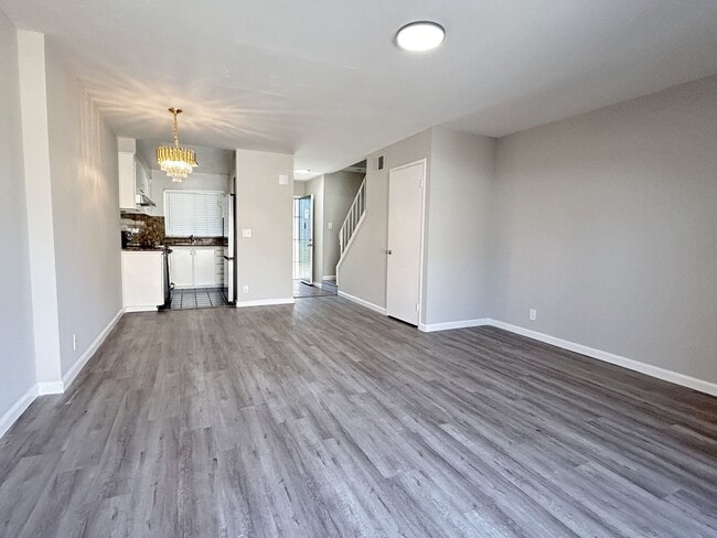 Building Photo - Move-in ready Evergreen townhome with private backyard, detached 2-car garage, and great communit...
