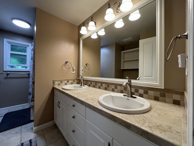 Building Photo - Three-Bedroom Home Near Nike Campus with Bonus Room, Large Deck & Two-Car Garage
