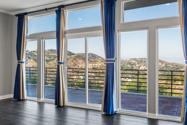 Building Photo - Modern Elegance Meets Scenic Privacy in Be...