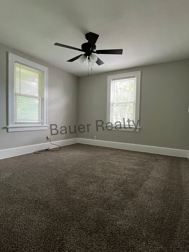 Building Photo - Three bedroom home with two car, detached garage!