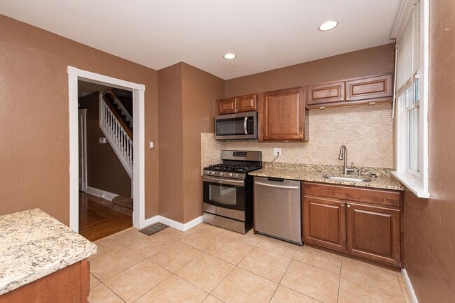 Building Photo - NORWOOD-  UNIT #1, 2+ bedroom 1.5 BATH W/ GARAGE /OVERSIZED YARD/DECK