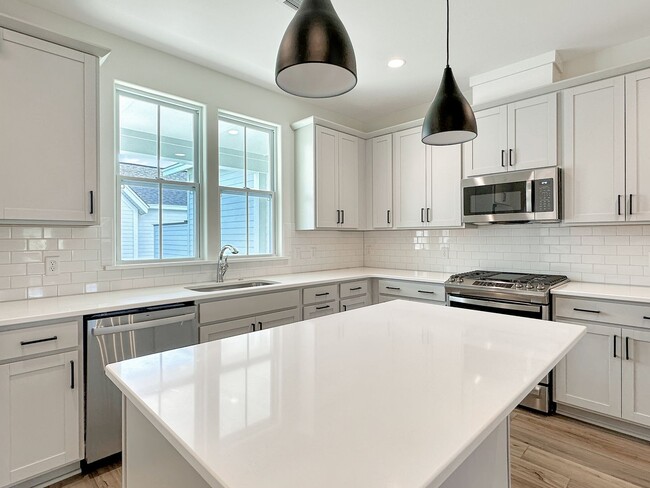 Building Photo - Beautiful, 3-Bedroom Midtown Nexton Townhome with Garage & Amenities