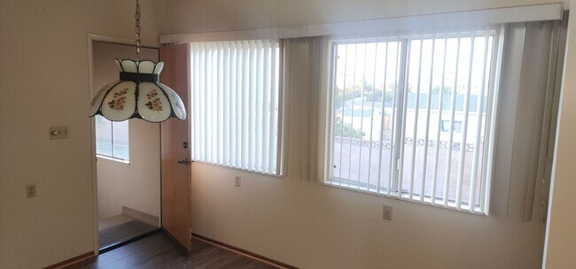 Building Photo - This is a spacious house featuring four bedrooms and two bathrooms, along with a two-car garage.