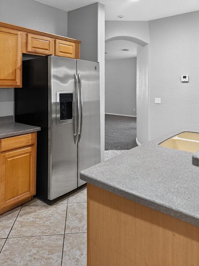 Building Photo - Single-level 4 bed, 2 bath home with tandem 3-car garage and RV gate.