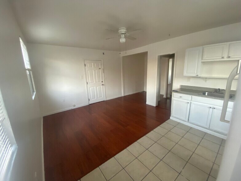 Kitchen view overlooking an area that can fit a queen-sized bed. - 1825 Wilcox Ave