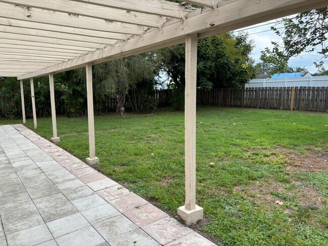 Building Photo - 2/2/1 home with a spacious fenced backyard...