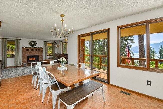 Building Photo - 2700 + sq ft family home has it all! Over 2 acres of land and a stunning view of Lake Pend Oreille