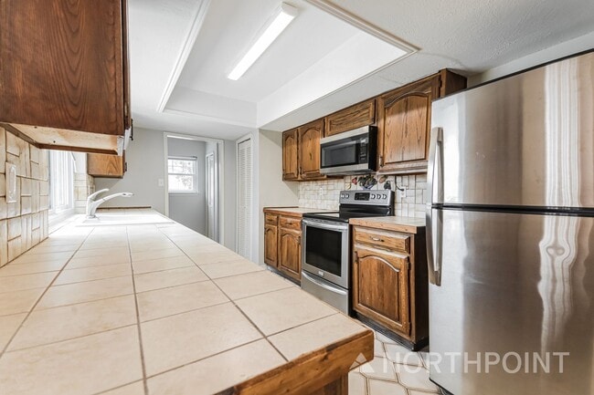 Building Photo - 4BR/2BA | Updated Single Family Home | 2-Car Garage Parking | Gated backyard