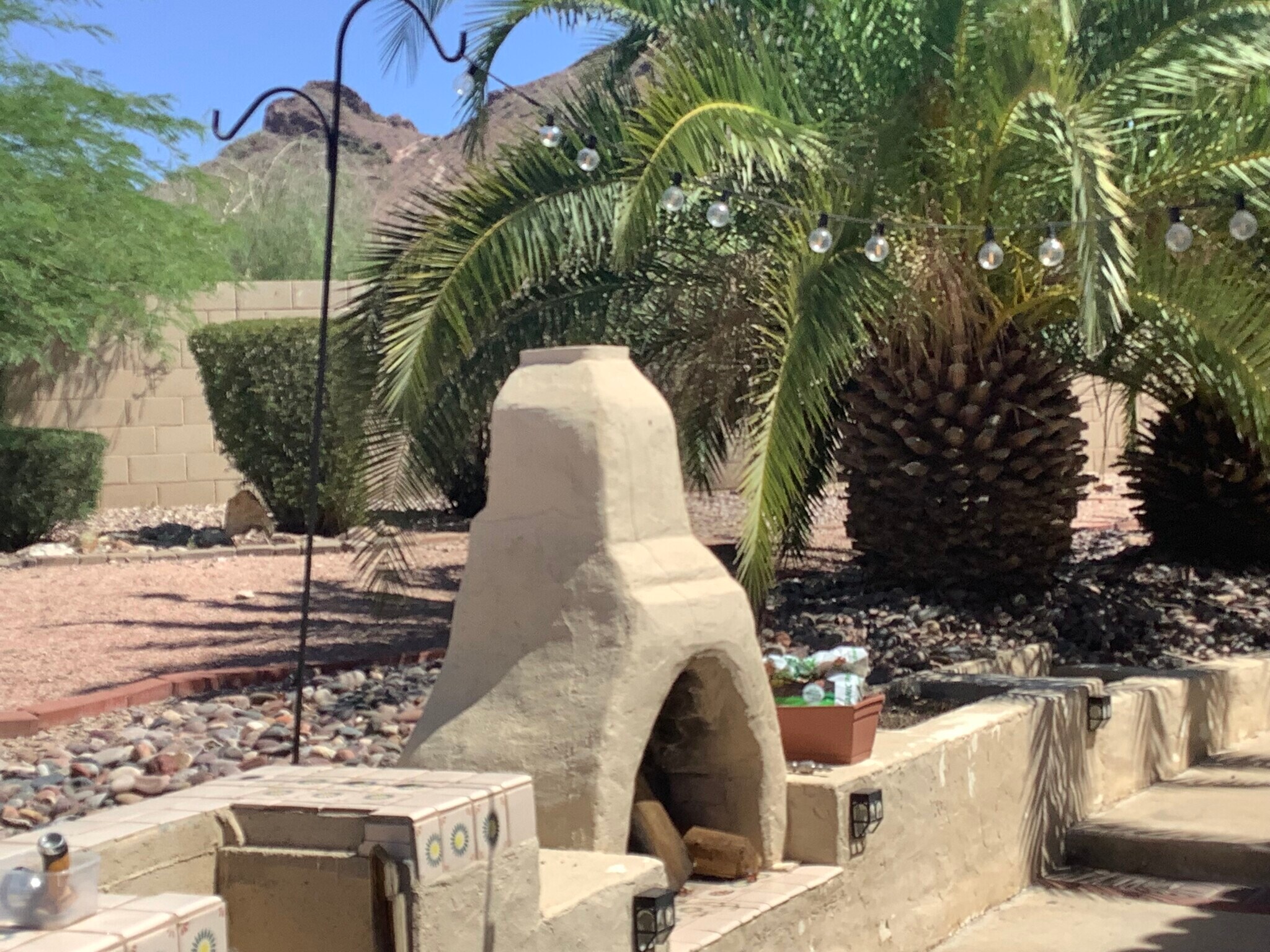 Outdoor fireplace in backyard with Mountain View’s - 1502 E Estrid Ave