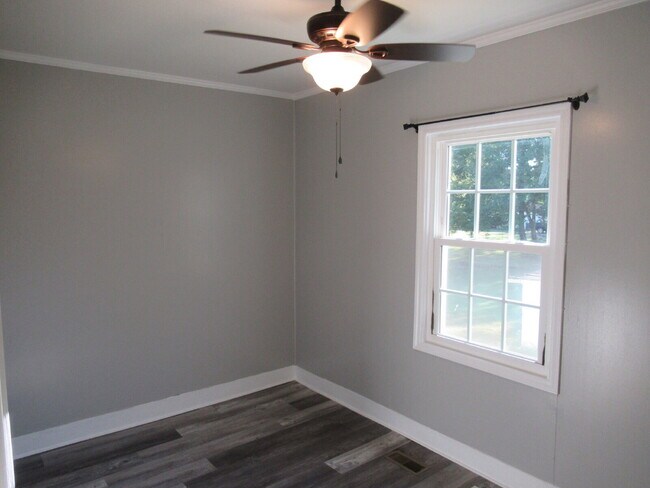 Building Photo - Check out this beautifully renovated white...