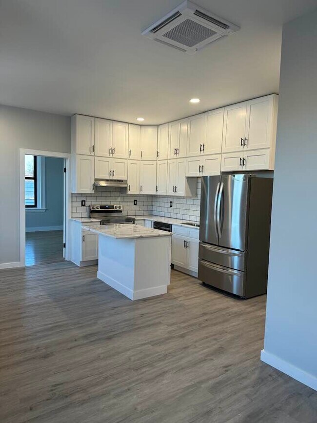 kitchen with ladder provided for upper cabinets - 1 Clinton St