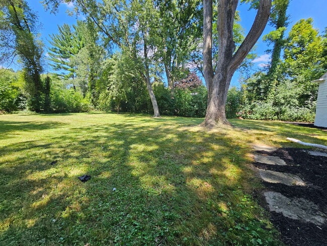 Building Photo - Private 4 Bedroom Home on 0.75 Acres with Great Room Fireplace, Wet Bar & 3-Season Room, 2 Car At...