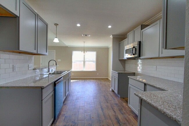 Building Photo - COMING SOON - 4 Bedroom Home + 2 Car Garage and Privacy Fenced Backyard!