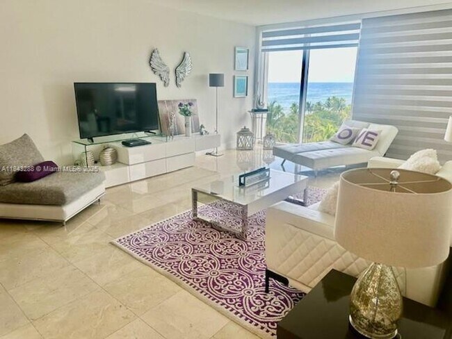 Building Photo - 10275 Collins Ave