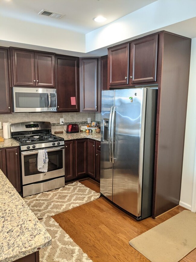 Building Photo - Bottom level (two story) *END UNIT* condo ...