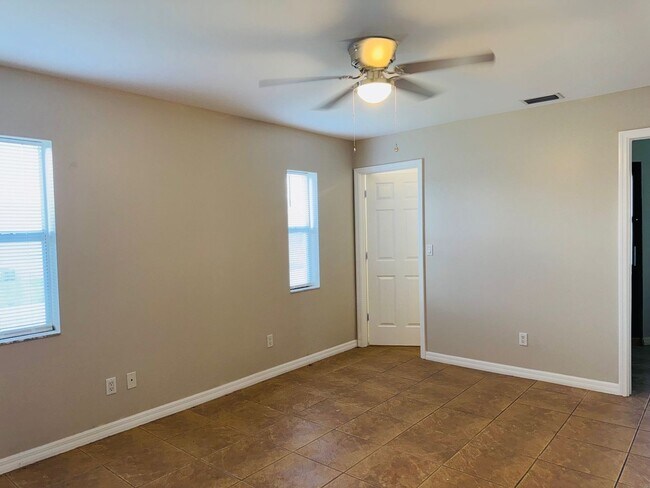 Building Photo - Experience this Cape Coral 3 bedroom 2 bath corner duplex with 1 car garage and screened in lanai.