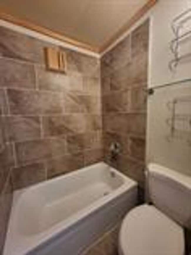 Building Photo - BEST DEAL IN SUMMIT !  Sunlight from all sides of the building!  Balcony! In unit washer dryer! B...