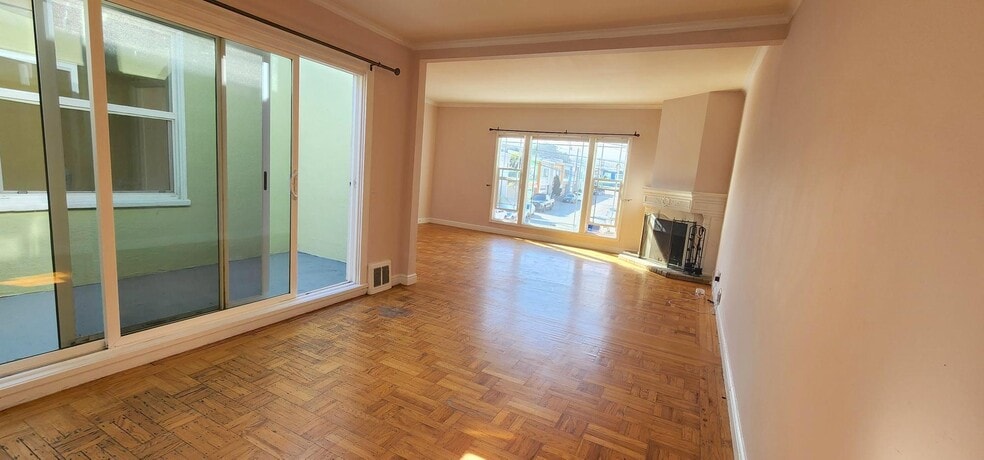 Central Solarium: 12' x 4' next to Dining room: 10'4" x 14' looking back at Living room: 14' x 19' - 245 Concord St