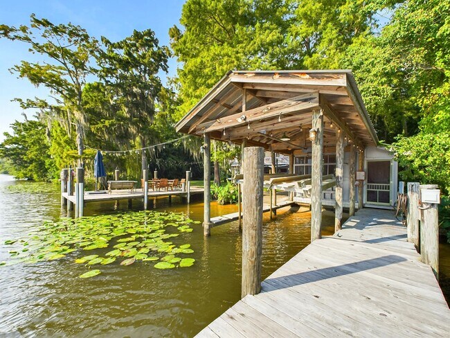 Building Photo - Private Furnished Riverfront Estate with Dock & Guest Apartment