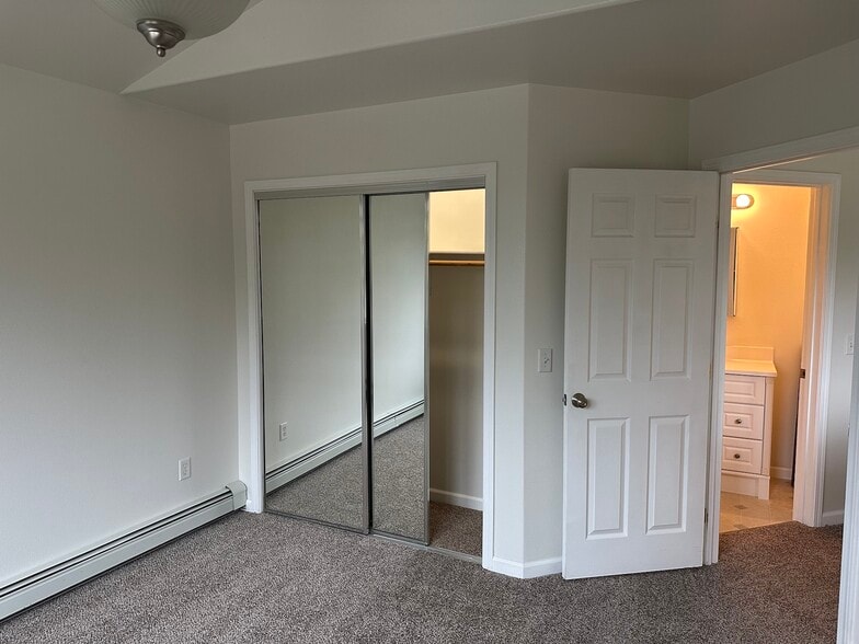 Bedroom #3 with light in closet and shows bath - 3887 Blessing Ave
