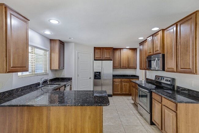 Building Photo - Spacious & Stylish 4/2 – Just  2 Miles fro...