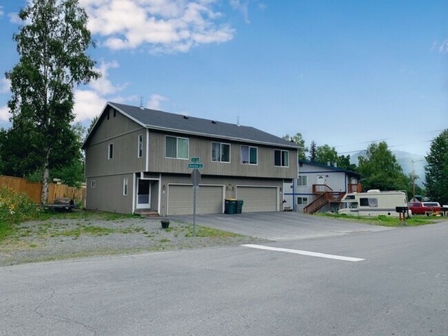 Building Photo - East Anchorage Townhouse with Yard, Garage, and W/D In unit! Close to JBER!