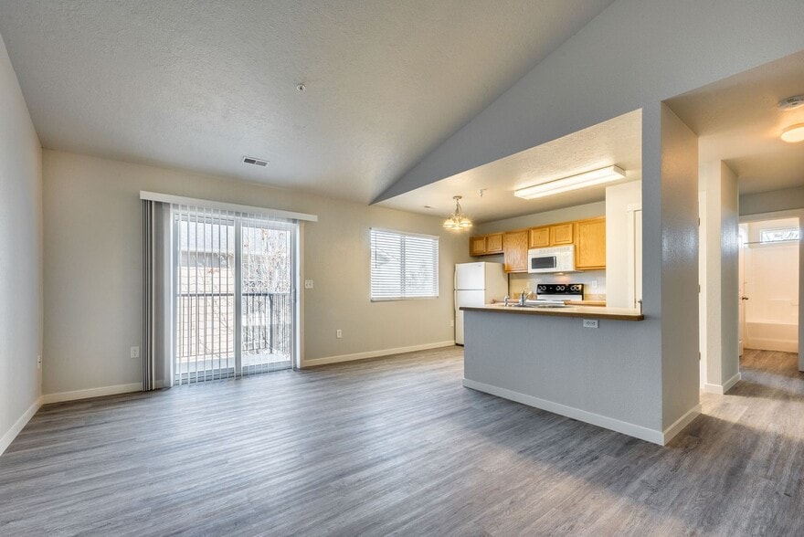 LIVING ROOM AND KITCHEN - Faith Landing Apartments
