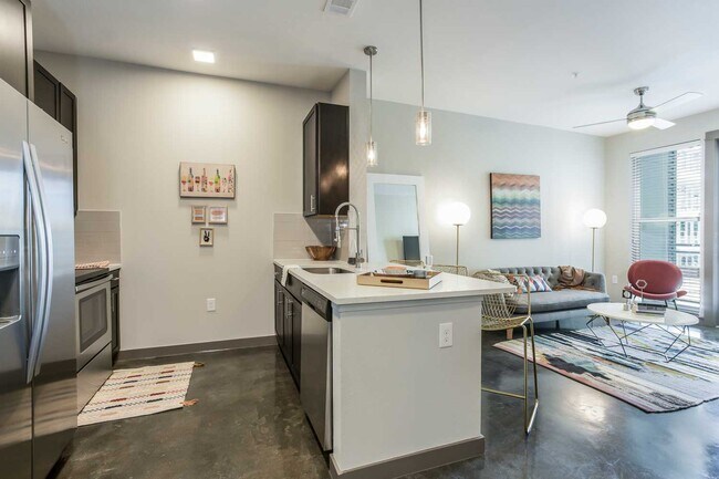 Building Photo - Your Downtown Lifestyle Begins Now