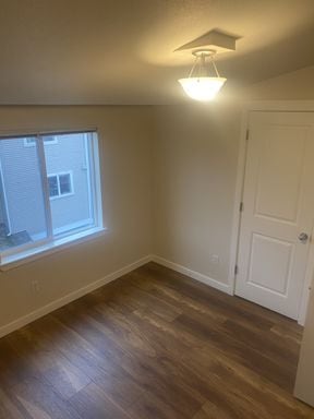 Building Photo - LIKE NEW three bedroom with fantastic updates, one car garage and private newly fenced front patio!