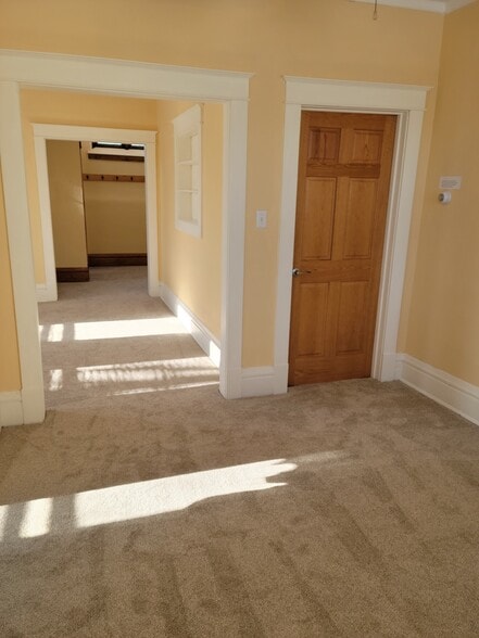 Dining room (looking through living room to entryway) - 100 Oxford St N