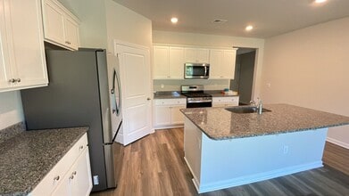 Building Photo - SPECIAL!  1/2 OFF 2ND MONTH RENT; 4 bedroom house in Market Commons