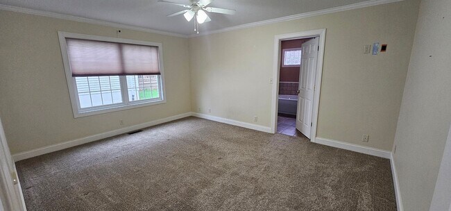 Building Photo - Welcome to this stunning 4 bedroom, 3 bath...