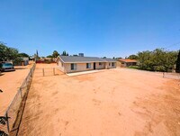 Building Photo - 4 bed with Dual master bedrooms and Solar ...