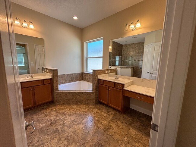 Building Photo - Spacious 4BR/3BA Home with 3-Car Garage, Bonus Office & Covered Patio in St Johns!