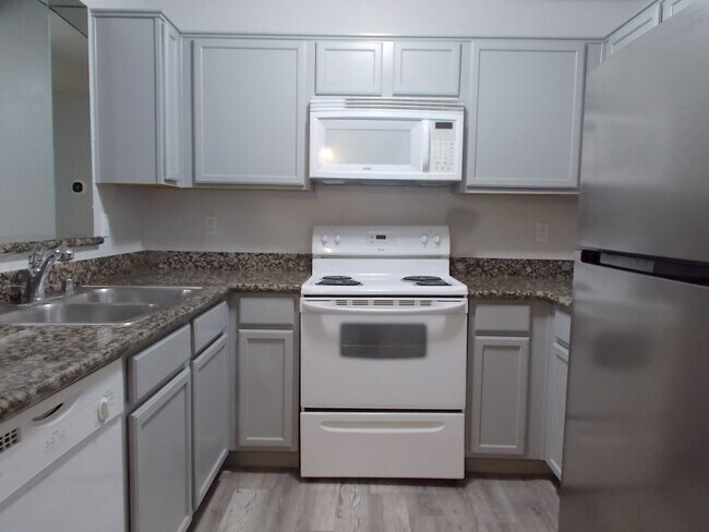 Building Photo - Comfort and Convenience in a Picturesque Gated Community