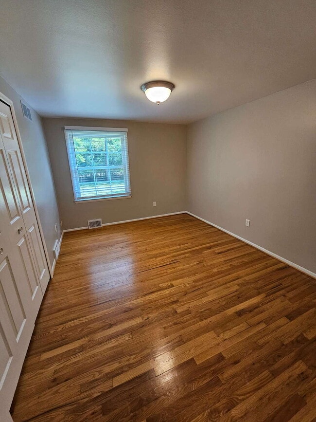 Building Photo - Private 4 Bedroom Home on 0.75 Acres with Great Room Fireplace, Wet Bar & 3-Season Room, 2 Car At...