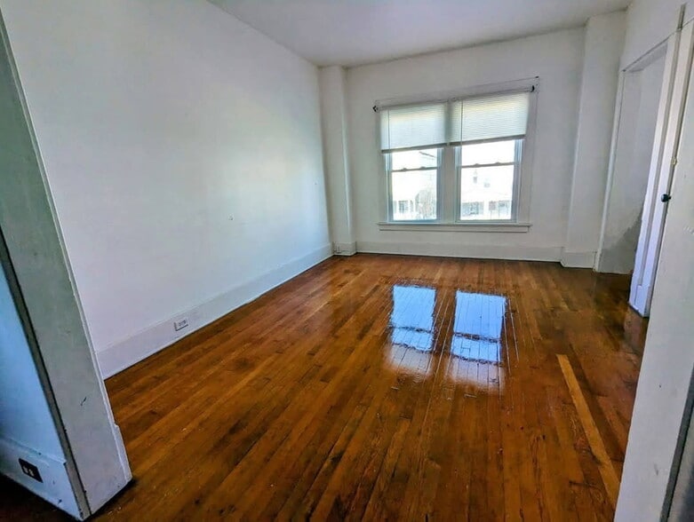 Large Living Room with Hardwood Floors and Porch - 65 Progressive Ave