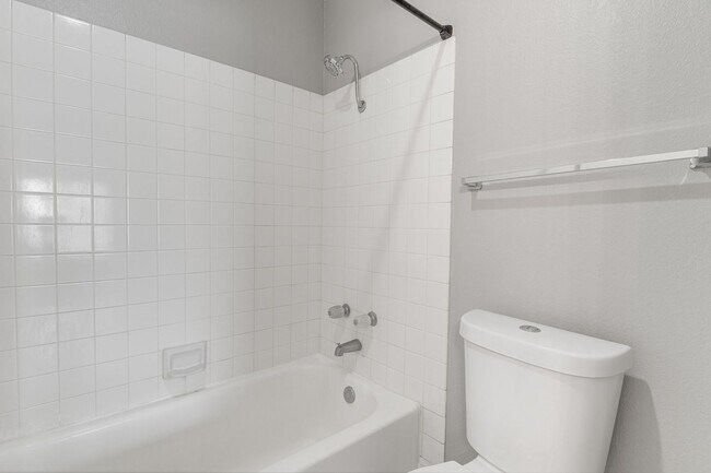 Building Photo - Stylish Upstairs Condo with Dual Primary S...