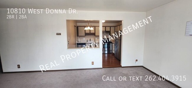 Building Photo - Two Bedroom Upper Condo w/ Utilities Included