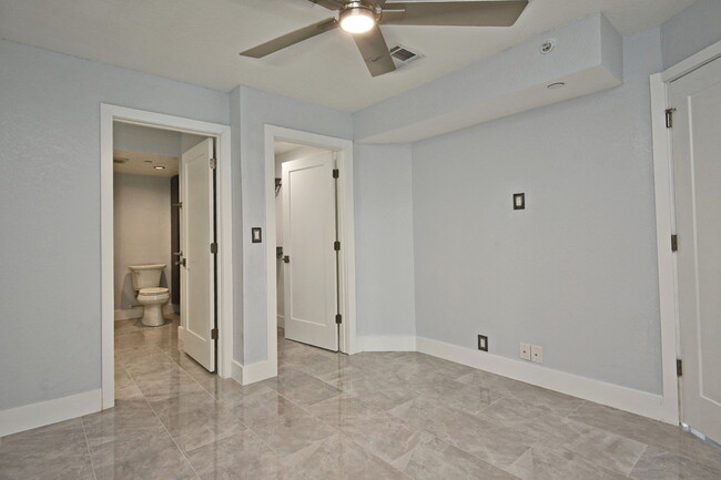 main bedroom showing closet and partial bath view - 400 E Colonial Dr