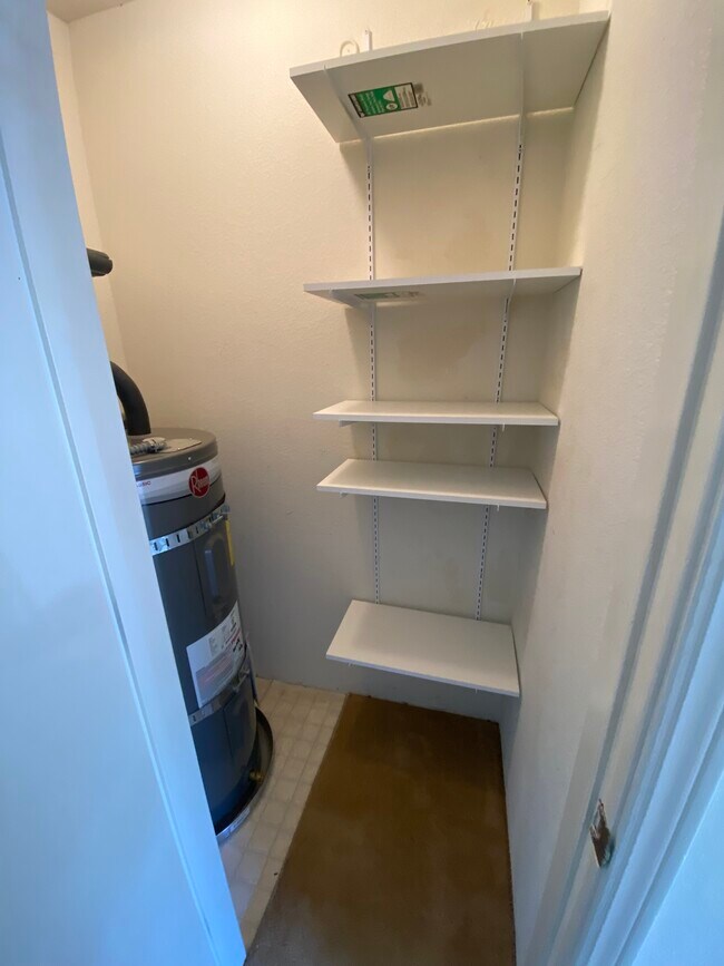 Pantry off kitchen with water heater - 445 Willow Ave