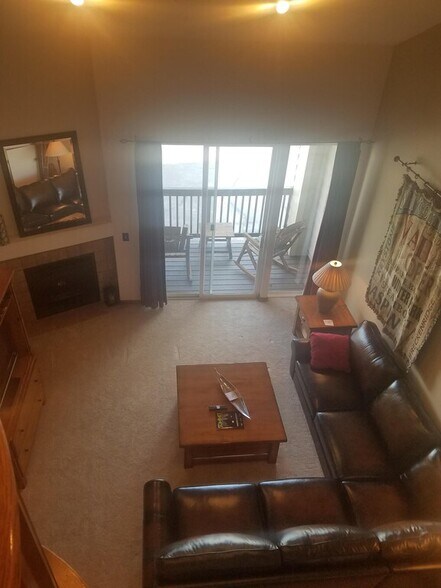 view from loft- Living room with front deck - 103 Morningstar Cir