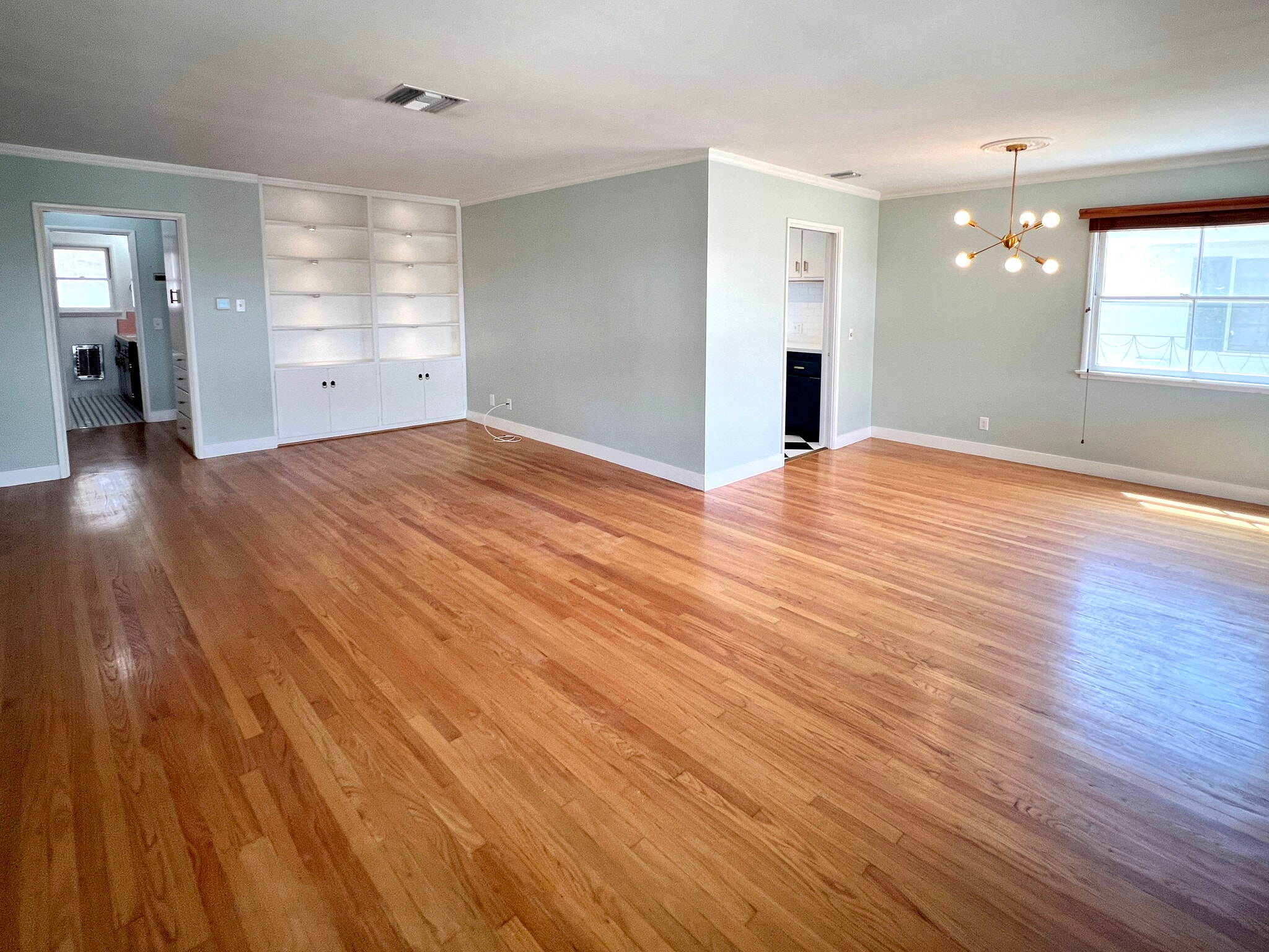Living and dining, built in bookcase with recessed lighting. - 1327 N Central Ave