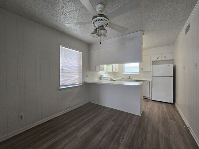 Building Photo - NEW VINYL FLOORING - AVAILABLE NOW!