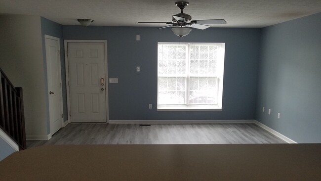 View of living room overlooking kitchen bar - 6306 Marsh Wren Drive