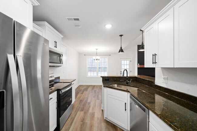 Building Photo - Pet Friendly Three Bedroom with Bonus!