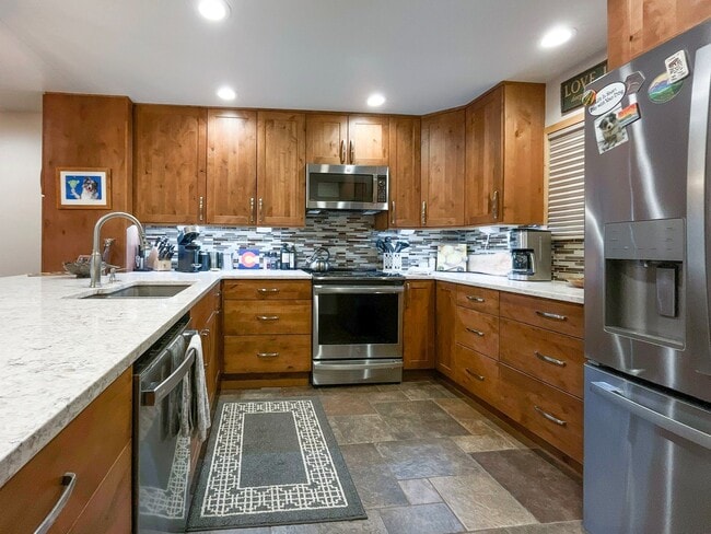 Building Photo - Walk to Town, Overlooking Carter Park, Garage Parking - Updated 2 Bed/2 Bath Available Now for Sk...